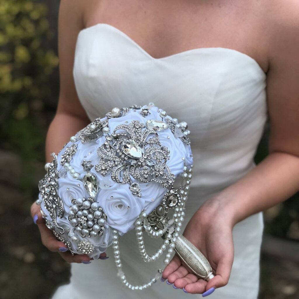 white silk flowers and silver beads brooch wedding bouquet
