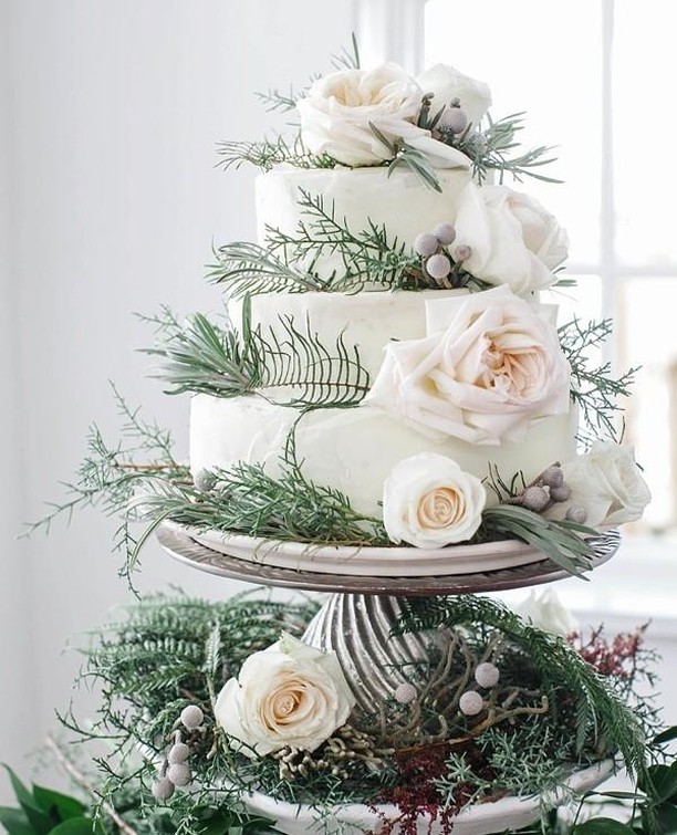 winter wonderland blush roses wedding cake with foliage