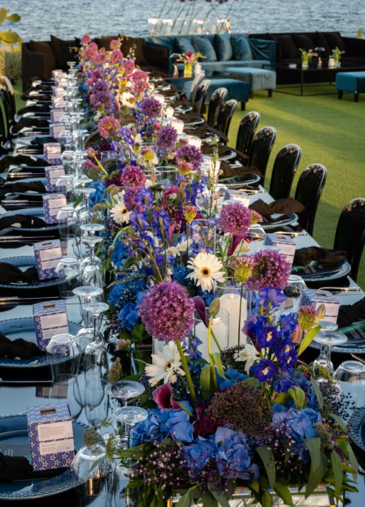 Blue and plum wedding reception table decor