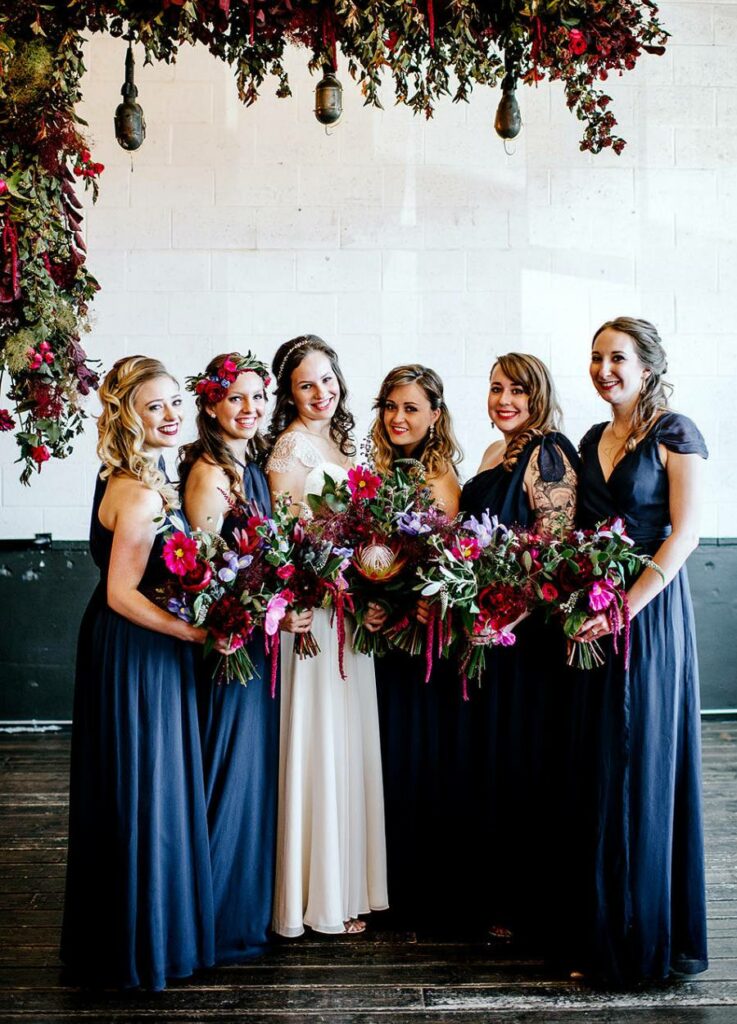 Navy Blue bridesmaid dresses with plum bouquet