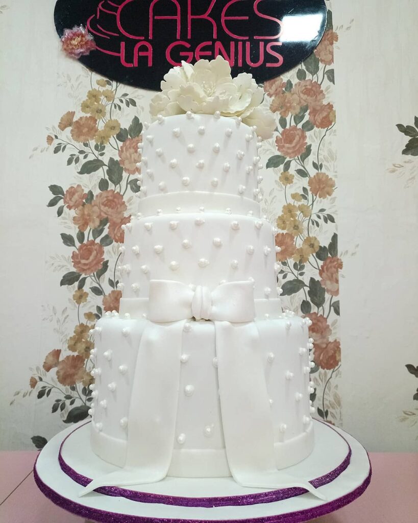 classic white pearl with bow wedding cake