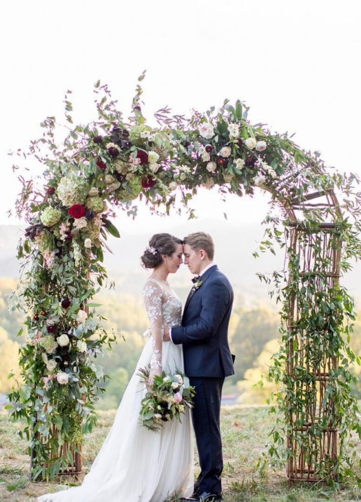 floral wedding arch with beautiful mountain view