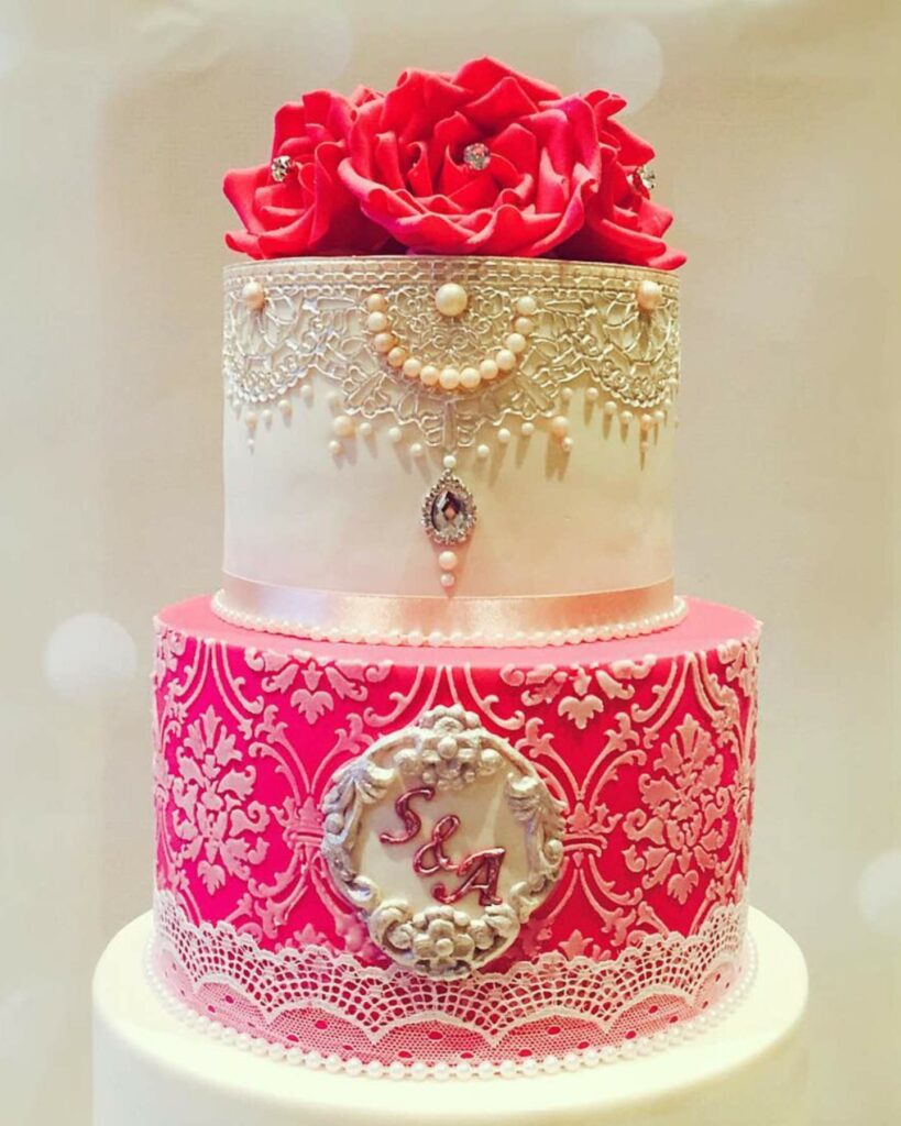lace and edible sugar pearl embellishment fuchsia wedding cake