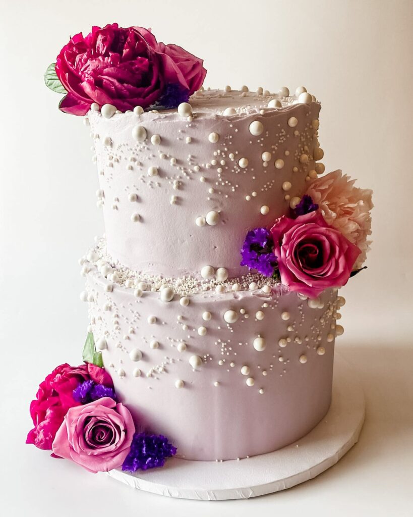 lavender pearl wedding cake with fresh blooms