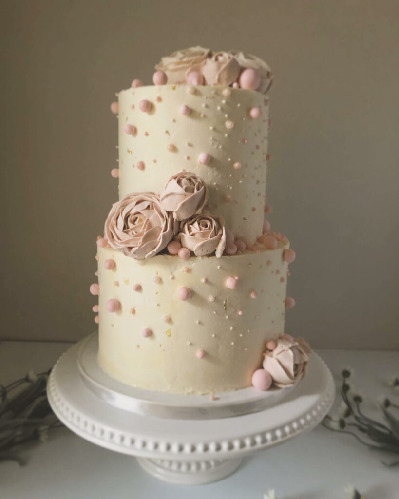 pearl balls with blush buttercream roses wedding cake