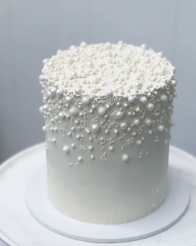simple and glam pearl one tier wedding cake