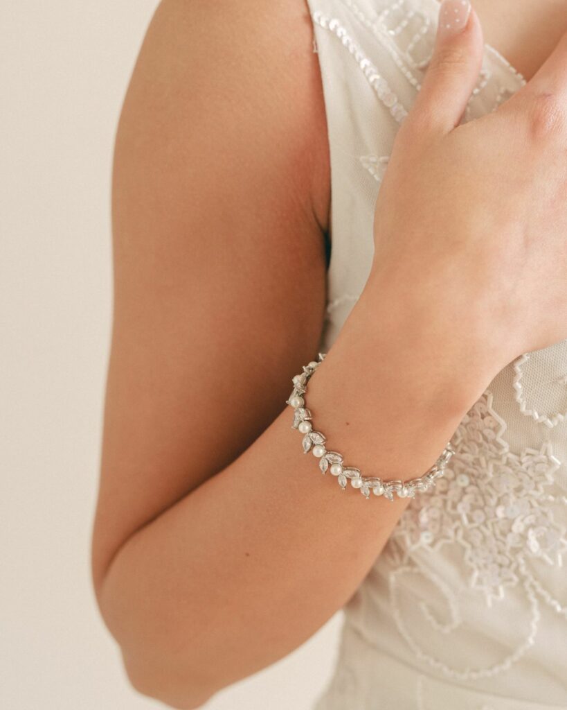exquisite silver crystal and pearl bridal bracelet in a dainty leaf design