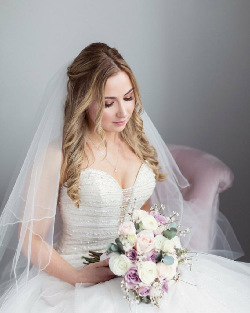 half up half down loose wave wedding hairstyle with veil