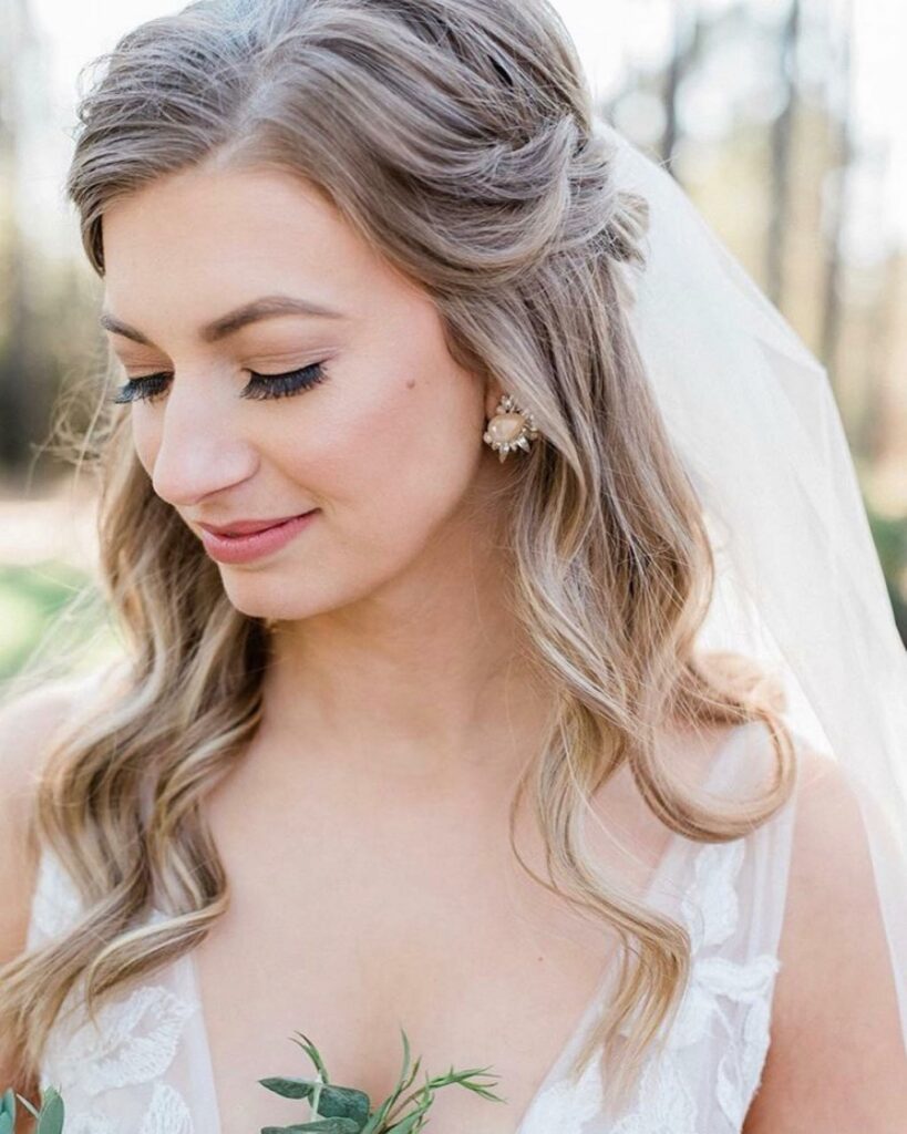 half up half down natural curl bridal hairstyle with veil for beach wedding