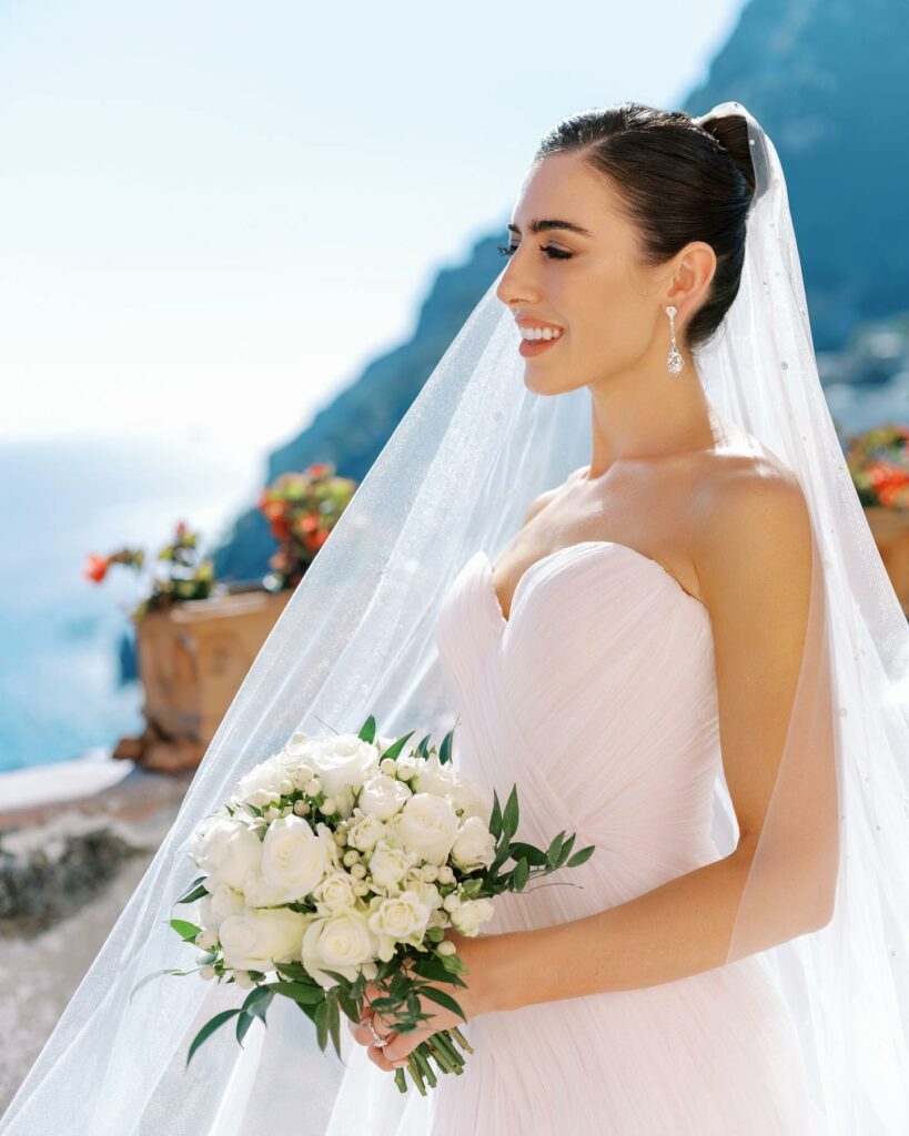 high bun short wedding hairstyle with cathedral length veil