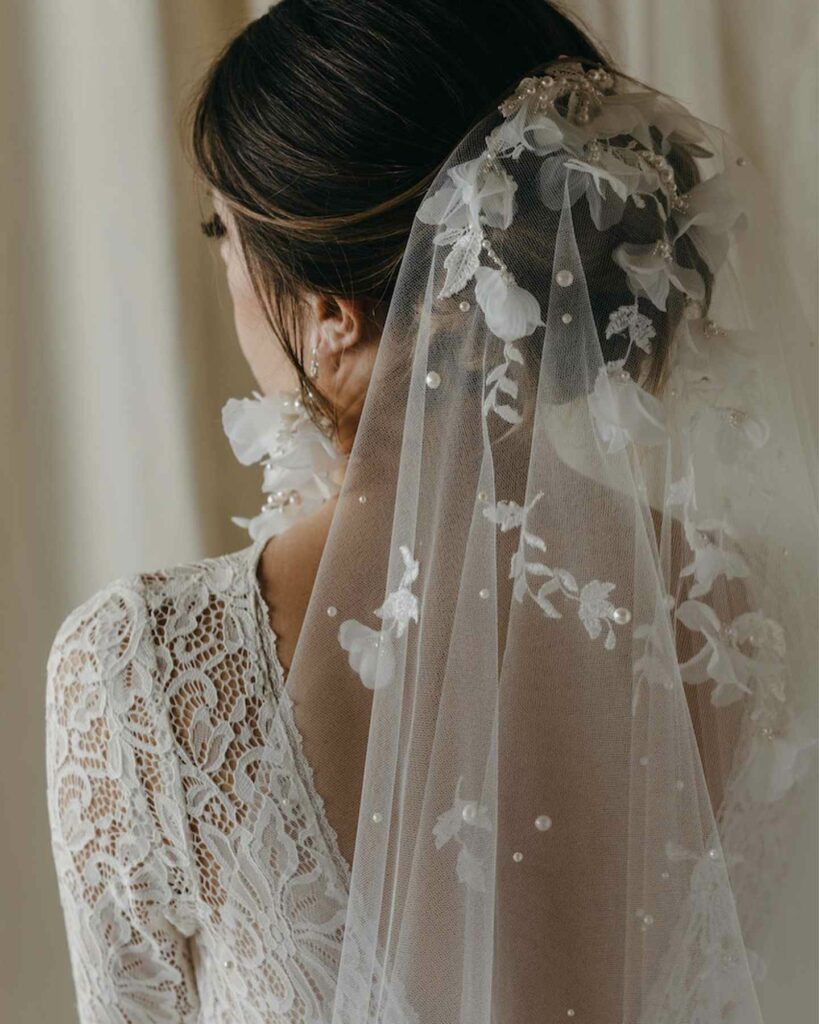 long hair wedding updo with embellished veil