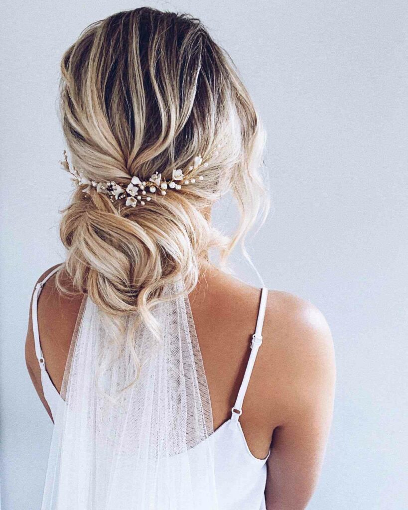 long loose curls wedding updo hairstyle with veils