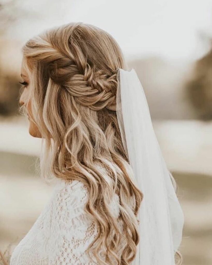 medium hair half up braided wedding hairstyle with veil