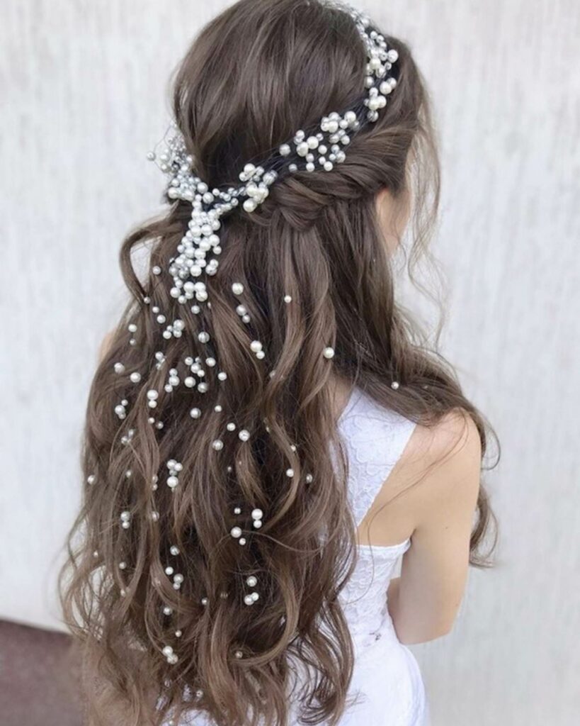 pearl adorn half up half down bridal hairstyle