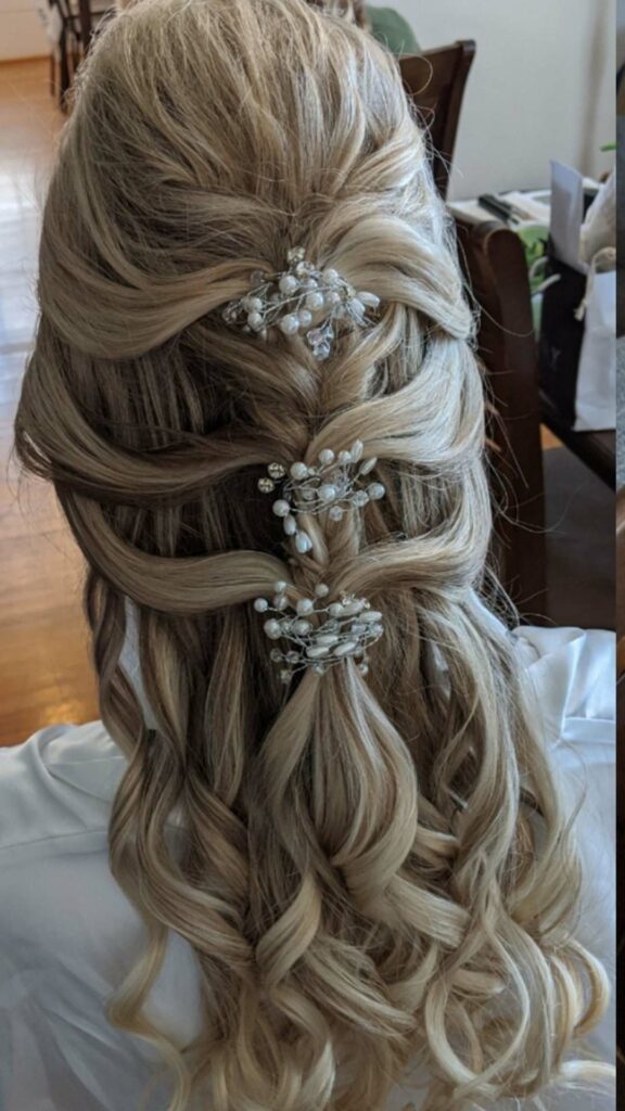 romantic half up half down wedding hairstyle with curls