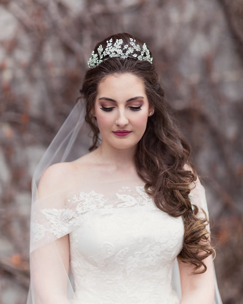 side swept with tiara and veil long wedding hairstyle