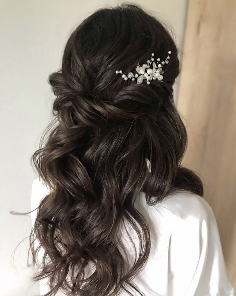 simple twisted half up half down black hair wedding hairstyle with hair piece