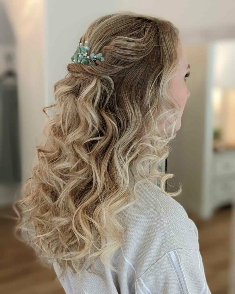 twisted half updo wedding hairstyle with mermaid curls