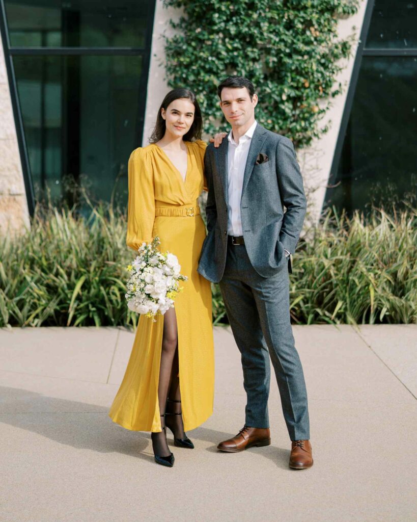 yellow wedding dress with ivory bouquet and black bridal shoes