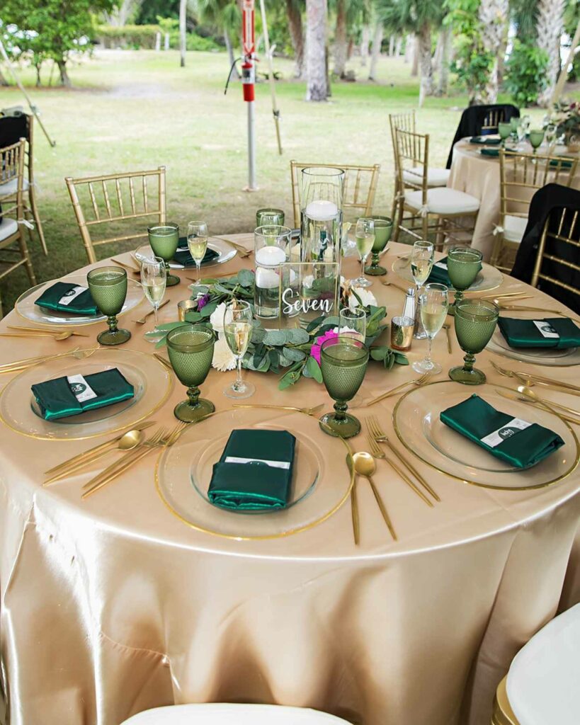 emerald green and gold wedding table decor with table number