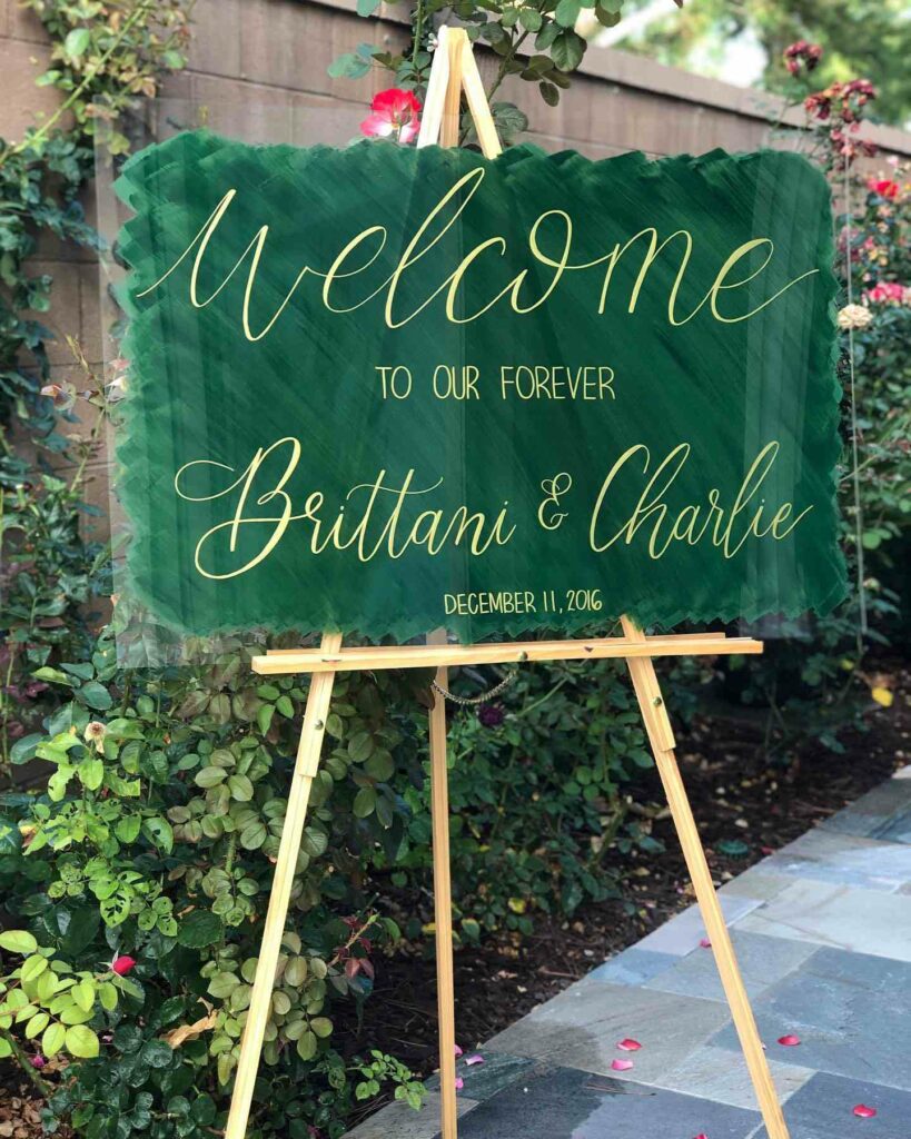 green and gold acrylic wedding welcome sign