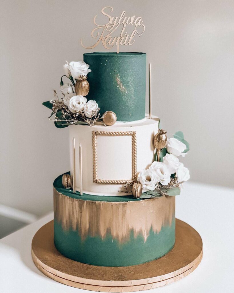 green and gold three tiered wedding cake with cake topper