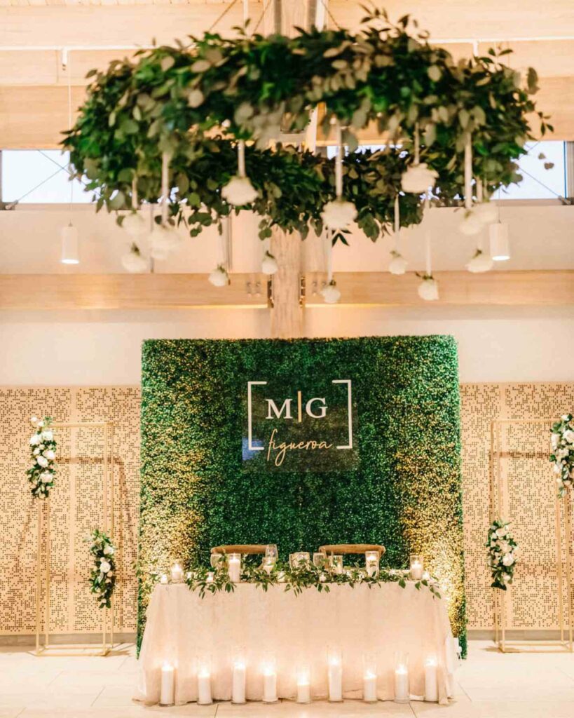 green and sparkling gold candle wedding backdrop