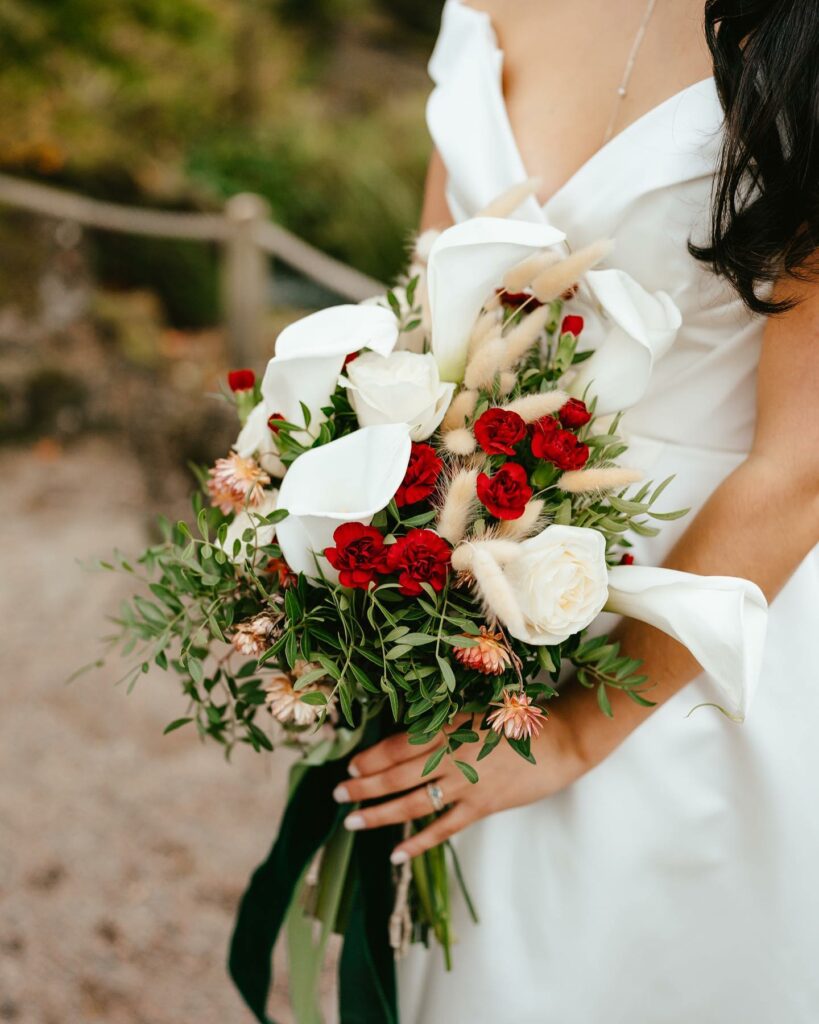 greenery and gold outdoor wedding bouquet with roses