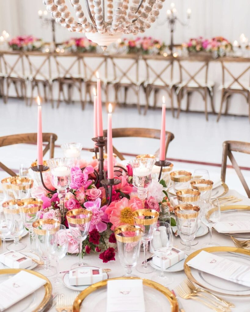 low florals, taper candles and hanging chandelier wedding centerpiece ideas