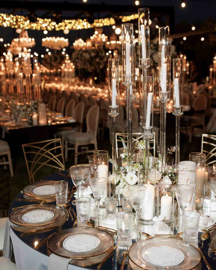 luxurious and modern wedding centerpiece with white rich florals and candles