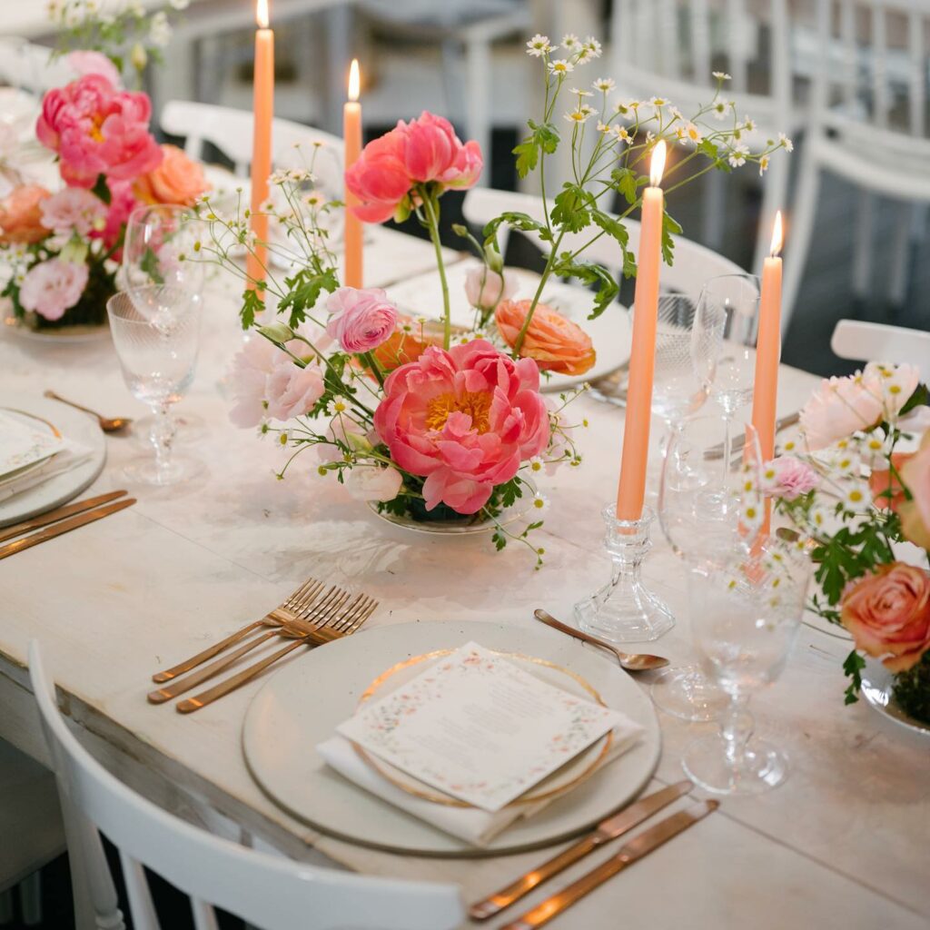 peach taper candle wedding centerpiece with pink flowers