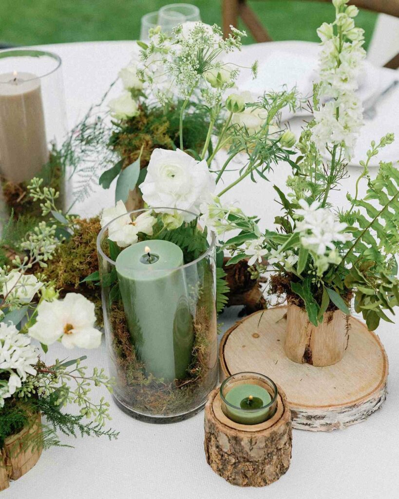 rustic wedding centerpiece with votive and pillar candles