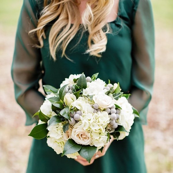 stunning gold bouquet with emerald bridesmaid dress