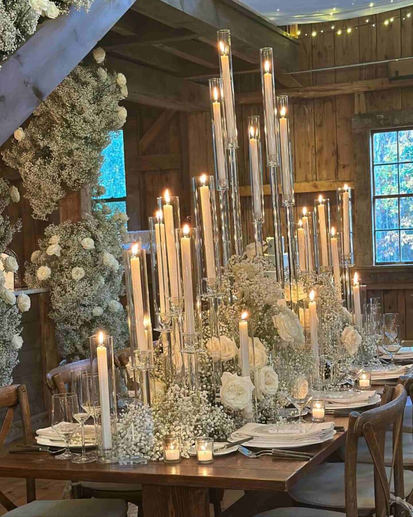 taper candle wedding centerpiece with baby's breath and white blooms
