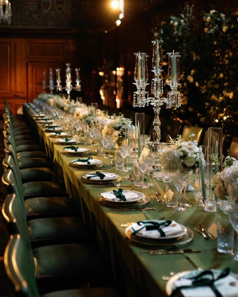 warm glow of candlelight adorned with lush green and gold touches wedding color palette