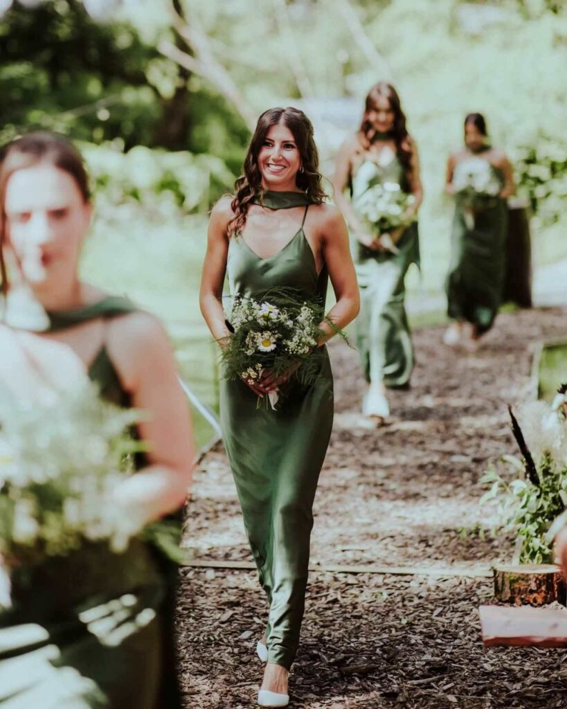 olive green satin bridesmaid dress with bouquet