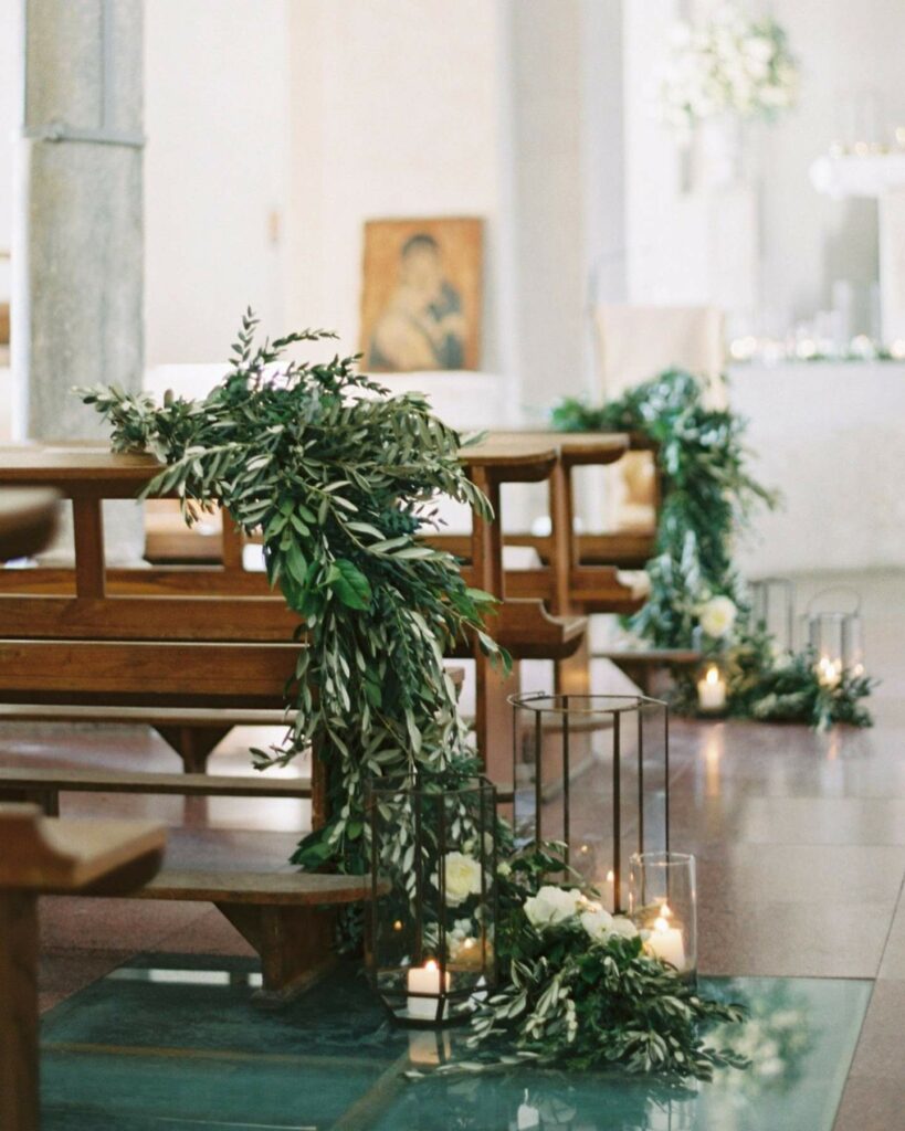 church wedding decoration with greenery and candles